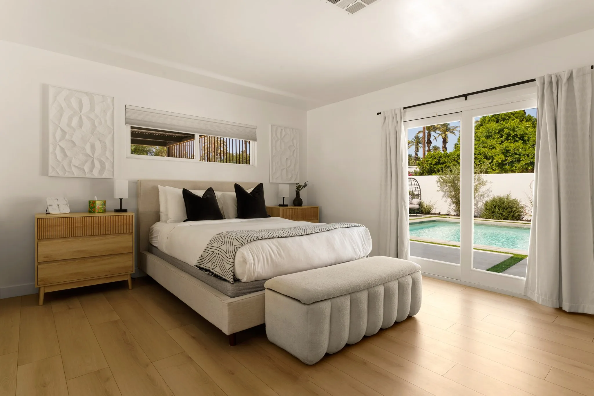Bedroom in white and pale oak, doors open to the pool, The Villa Palms, Indio, California